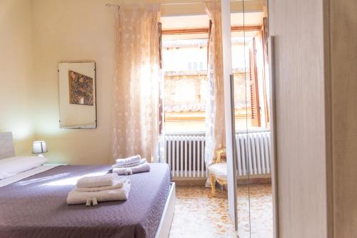 Postel nebo postele na pokoji v ubytování Appartamento in centro