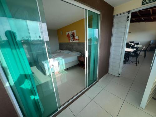 Una cama o camas en una habitación de Pousada Dunas Beach