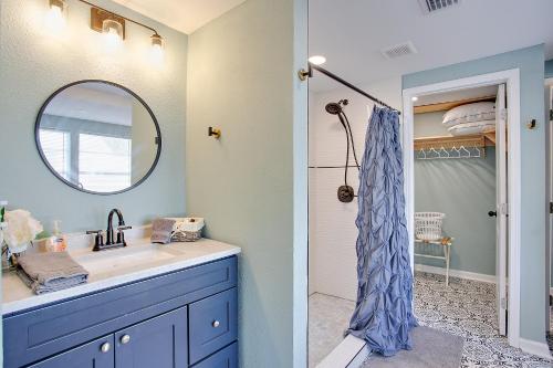a bathroom with a blue sink and a mirror at Modern Retreat Lake House @Lake Talquin in Tallahassee