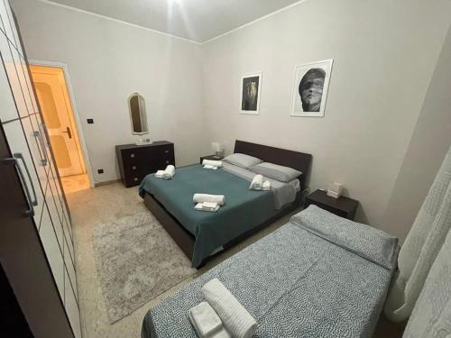 Postel nebo postele na pokoji v ubytování Casa intera Torino - Museo Egizio - Stadio - Pala Alpitour - Via Gravere 20