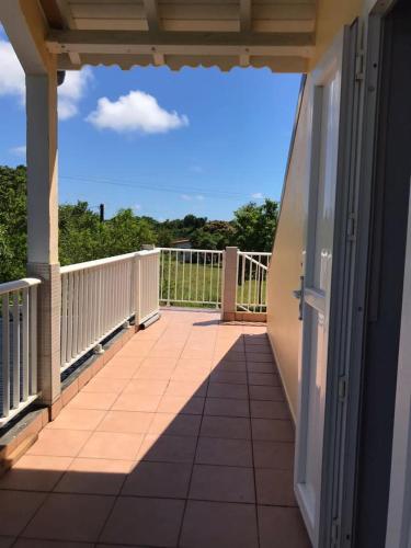 a balcony of a house with a view of the sky at Appartements Bois Jolis in Rabi