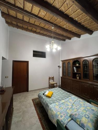 En eller flere senge i et værelse på Casa di Mirto