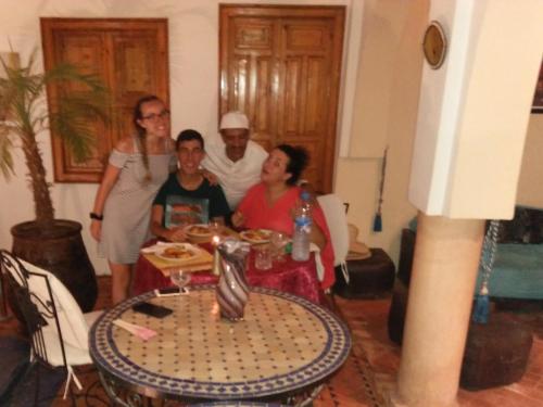 a group of people sitting around a table at RIAD GREEN LOTUS in Marrakech