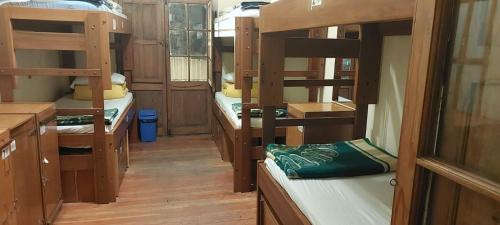 a room with four bunk beds in a bus at BB&B Hostel in La Paz