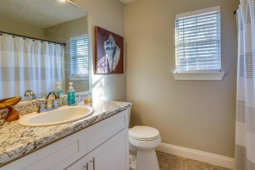 a bathroom with a sink and a toilet at Family-Friendly PCB Vacation Rental, Walk to Beach in Panama City Beach