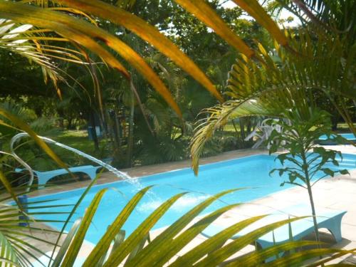 The swimming pool at or close to Sítio Conquista Feliz