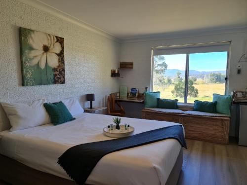 Postel nebo postele na pokoji v ubytování Vacy Hunter Valley Lodge