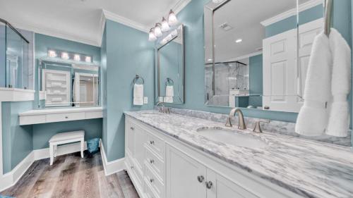 a bathroom with a sink and two mirrors at Crystal Dunes 405 - 3 BR Beach Front in Destin