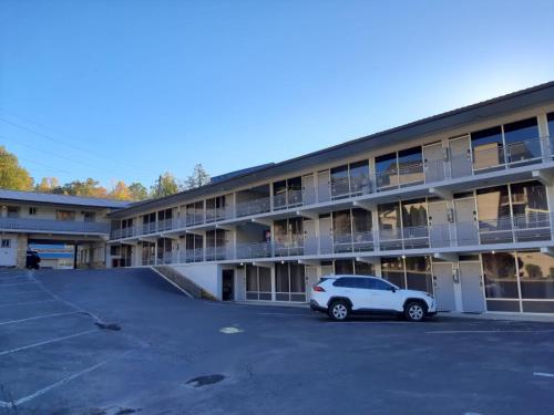 a car parked in a parking lot in front of a building at Timber Ridge Lodge Gatlinburg in Gatlinburg