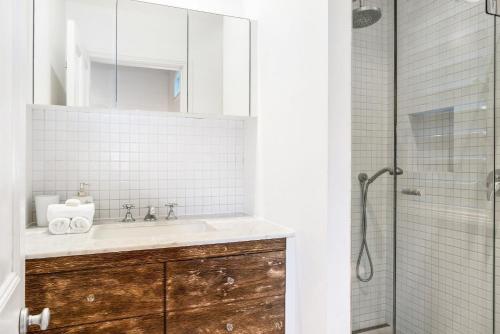 a bathroom with a sink and a shower at A Perfect Stay - Kia Ora Byron in Byron Bay