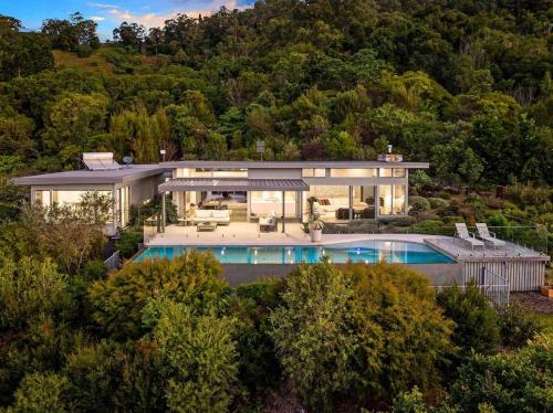an aerial view of a house with a swimming pool at The Springs - architect-designed home with pool in Mullumbimby