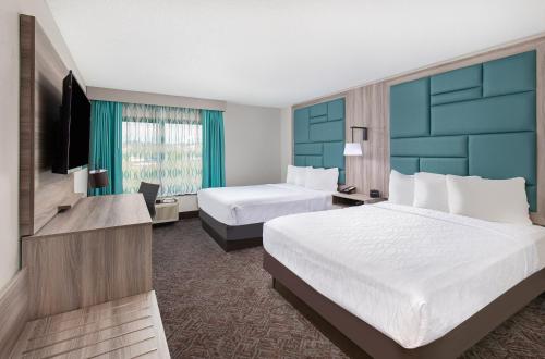 Ένα ή περισσότερα κρεβάτια σε δωμάτιο στο La Quinta Inn by Wyndham Pigeon Forge-Dollywood