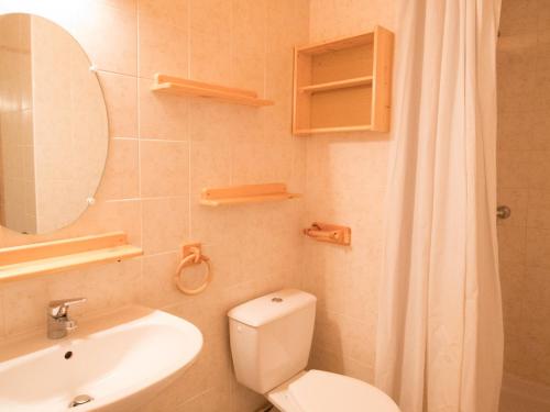 a bathroom with a toilet and a sink and a mirror at Appartement Aussois, 4 pièces, 8 personnes - FR-1-508-83 in Aussois