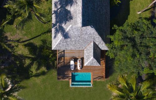 an overhead view of a house with a swimming pool at Conrad Bora Bora Nui in Bora Bora