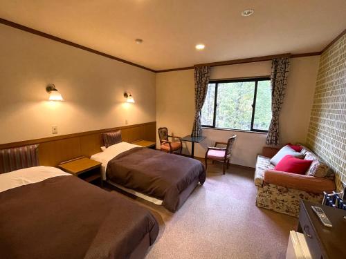 Postel nebo postele na pokoji v ubytování Heidihof Hotel
