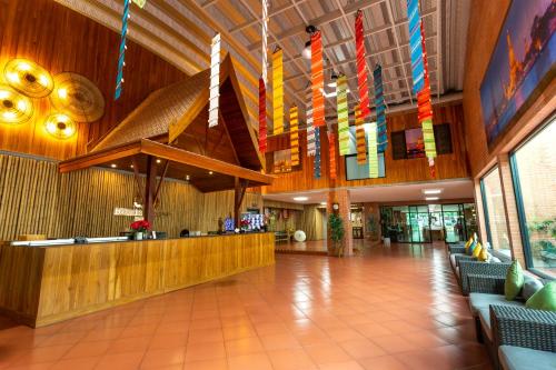 a lobby of a hospital with flags hanging from the ceiling at Baan Thai Boutique in Bangkok