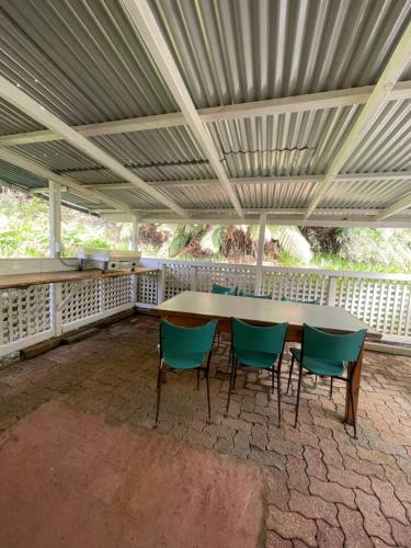 a table and chairs in a covered patio at Mountain View Motel in Queenstown