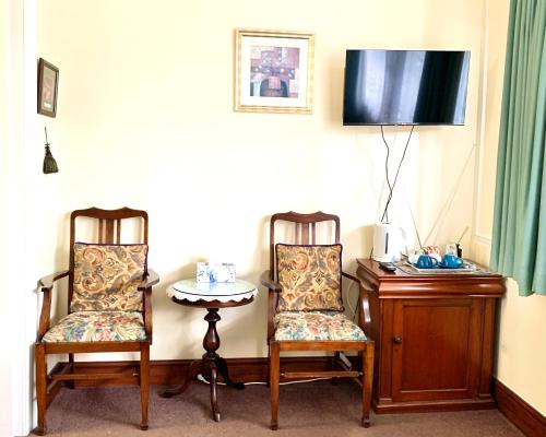 Télévision ou salle de divertissement dans l'établissement Orana House