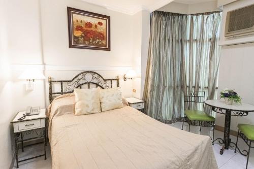 Postel nebo postele na pokoji v ubytování Hotel Canelsa