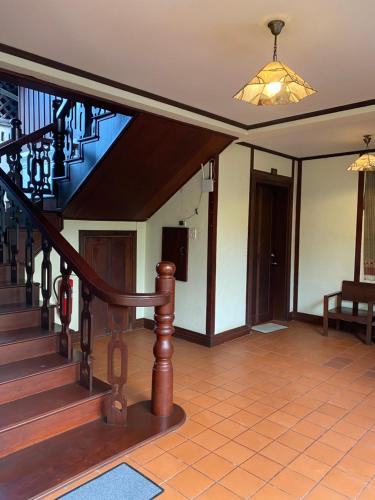 a staircase in a house with a stair case at Luang Prabang Residence & Travel in Luang Prabang