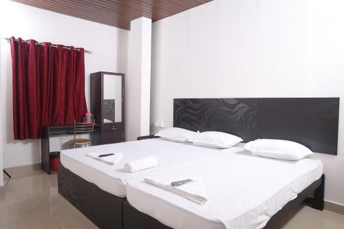 Postel nebo postele na pokoji v ubytování ACE SUITES