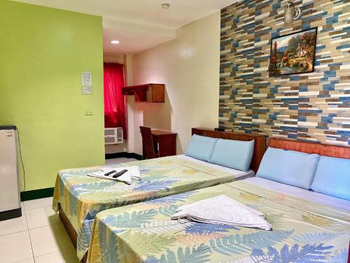 Voodi või voodid majutusasutuse Aosmec Square Hotel toas
