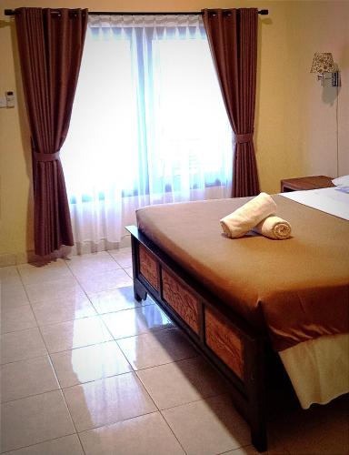 Кровать или кровати в номере Hotel My Lovina