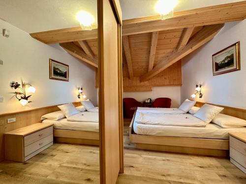Una cama o camas en una habitación de B&B Cèsa Planber Mountain View SKI-IN SKI-OUT