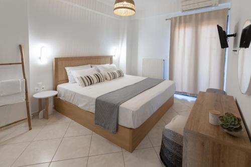 Postel nebo postele na pokoji v ubytování Frosini Seafront Loft