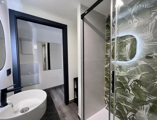 a bathroom with a sink and a mirror at LEYENDA DEL HEREJE in Seville