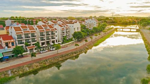 an aerial view of a city with a river at Laluna Hoi An Riverside Hotel & Spa in Hoi An