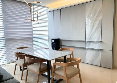 a dining room with a table and chairs at Lux & Spacious 3BR in Central Jakarta in Jakarta