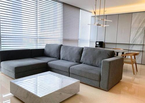 a living room with a couch and a table at Lux & Spacious 3BR in Central Jakarta in Jakarta