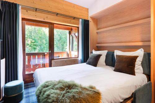 Postel nebo postele na pokoji v ubytování Mamie Megève