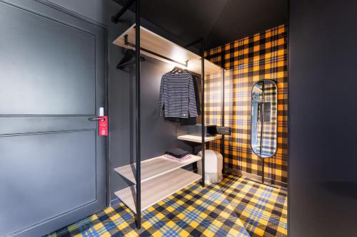 a bathroom with a shower and a tiled floor at Mamie Megève in Megève