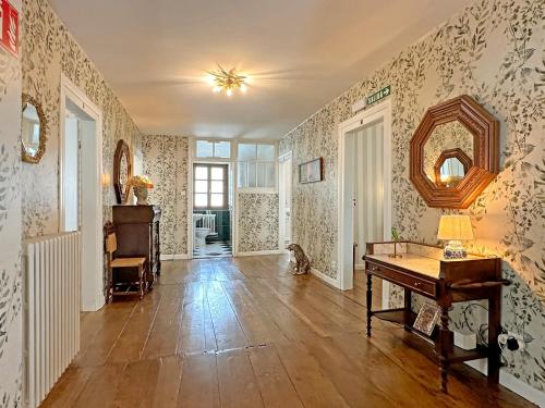 an empty room with a piano and a mirror at ETXEALE in Valcarlos