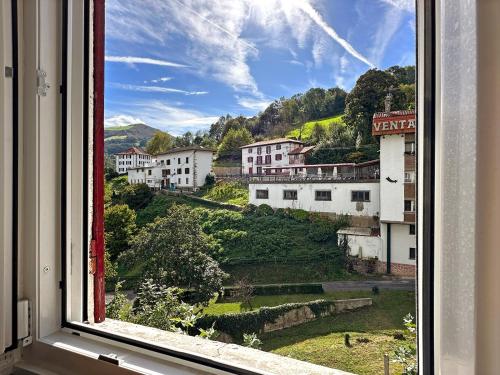 a view from a window of a village at ETXEALE in Valcarlos