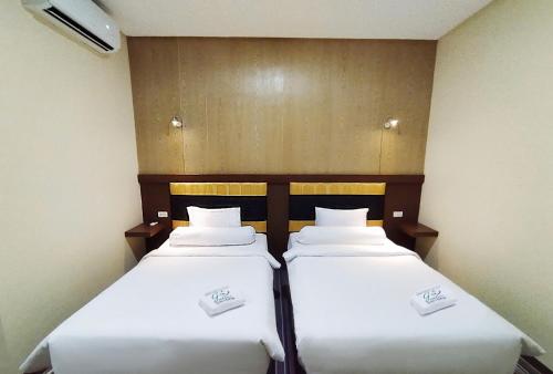 Katil atau katil-katil dalam bilik di Hotel Syariah GS Lampung Culture, Bandar Lampung