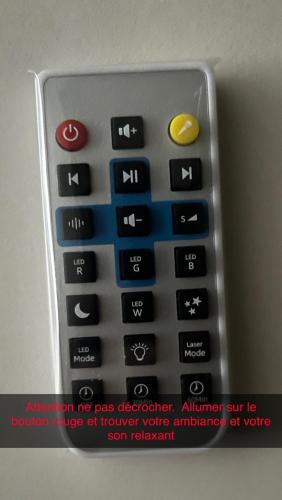 a remote control sitting on top of a fax machine at Escale Caux Cooning**** Charme et Balneo Etretat in Étretat