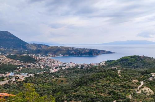 a view of a city and a body of water at Castle of Himara in Himare