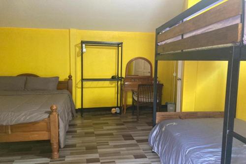 Un ou plusieurs lits dans un hébergement de l'établissement Nokkamin Home Chiang Dao