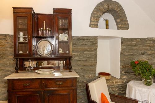 a dining room with a hutch and a table at Tina & Miltos in Kariá