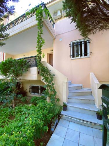 a stairway leading to a building with plants at nicole's home in Athens