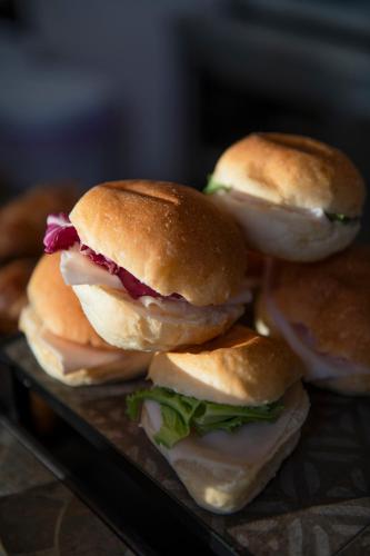 a group of sandwiches sitting on a tray at International Hotel & Suite in San Benedetto del Tronto