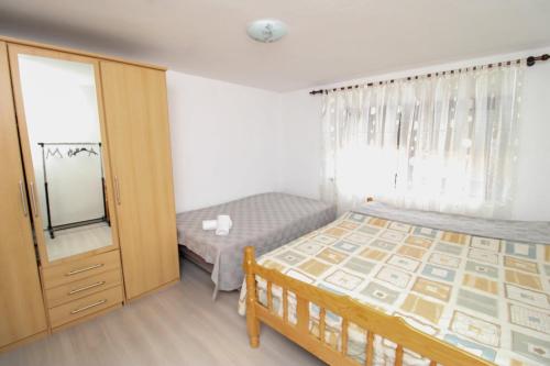 Postel nebo postele na pokoji v ubytování Apartman Elez