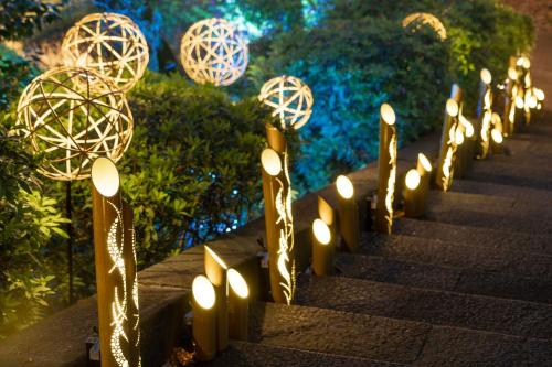 a row of candles on a stairway with lights at Grand Prince Hotel Shin Takanawa in Tokyo