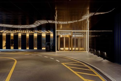 an empty building at night with lights on it at Wyndham Grand Busan in Busan