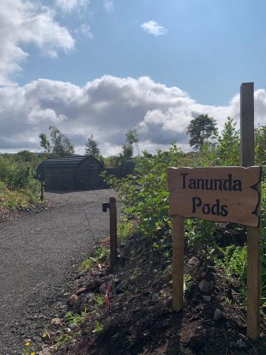 a sign on the side of a road at Tawny Owl Pod with Hot Tub in Oban