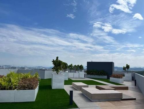 a patio with grass and plants on a building at Dilla Homestay At Bangi UKM Kajang in Kajang