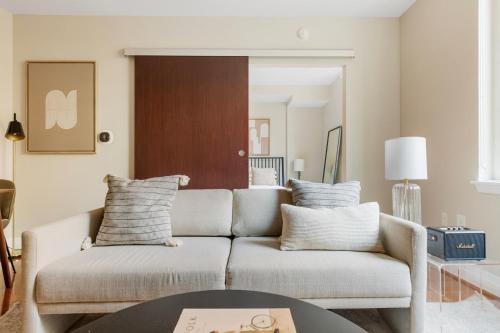 a living room with a couch and a table at Foggy Bottom 1br w wd pool gym nr Georgetown WDC-658 in Washington, D.C.